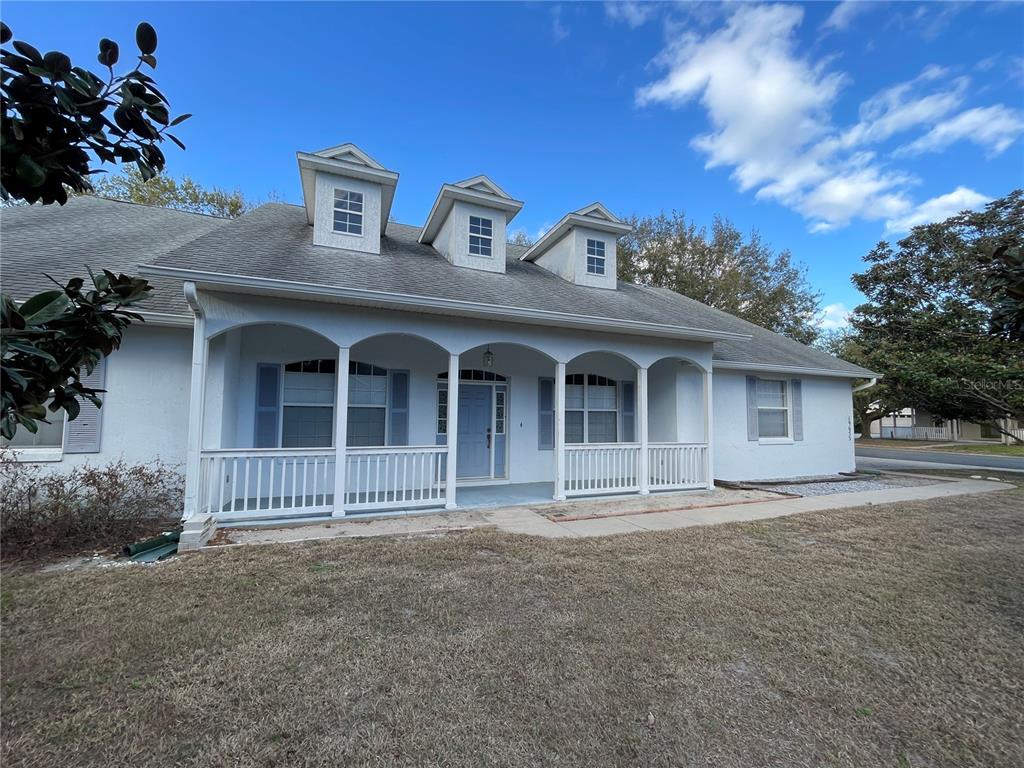 19655 Spring Oak Drive Eustis, FL 32736 - Photo 1 of 1 a front view of a house with a garden