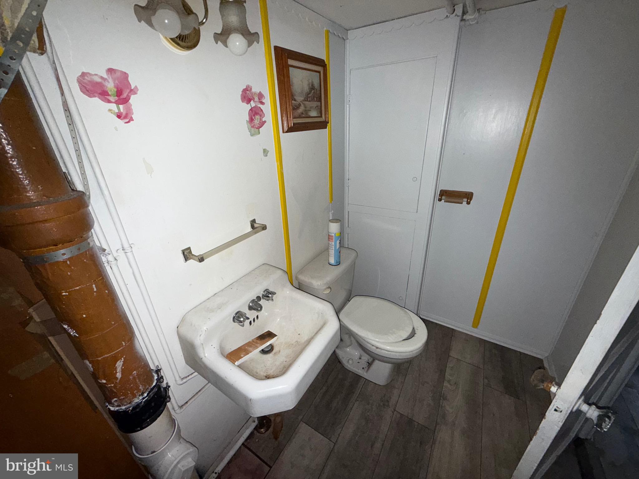 363 Sherbrook Boulevard Upper Darby, PA 19082 - Photo 7 of 12 a bathroom with a sink and toilet