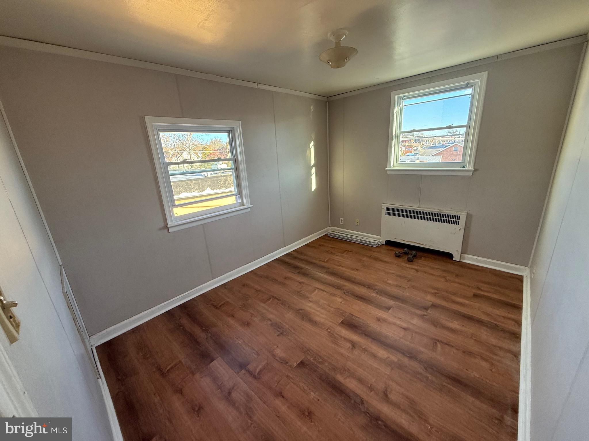 363 Sherbrook Boulevard Upper Darby, PA 19082 - Photo 10 of 12 a view of empty room with wooden floor and fan
