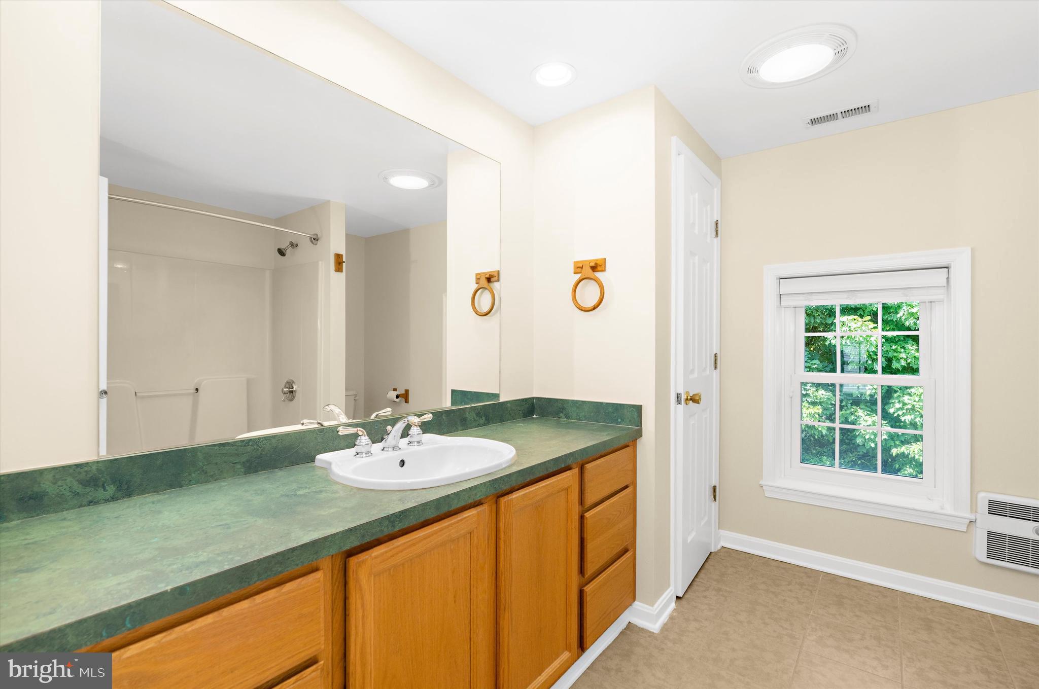 12714 Still Pond Road Still Pond, MD 21667 - Photo 47 of 62 a bathroom with a granite countertop sink and a mirror