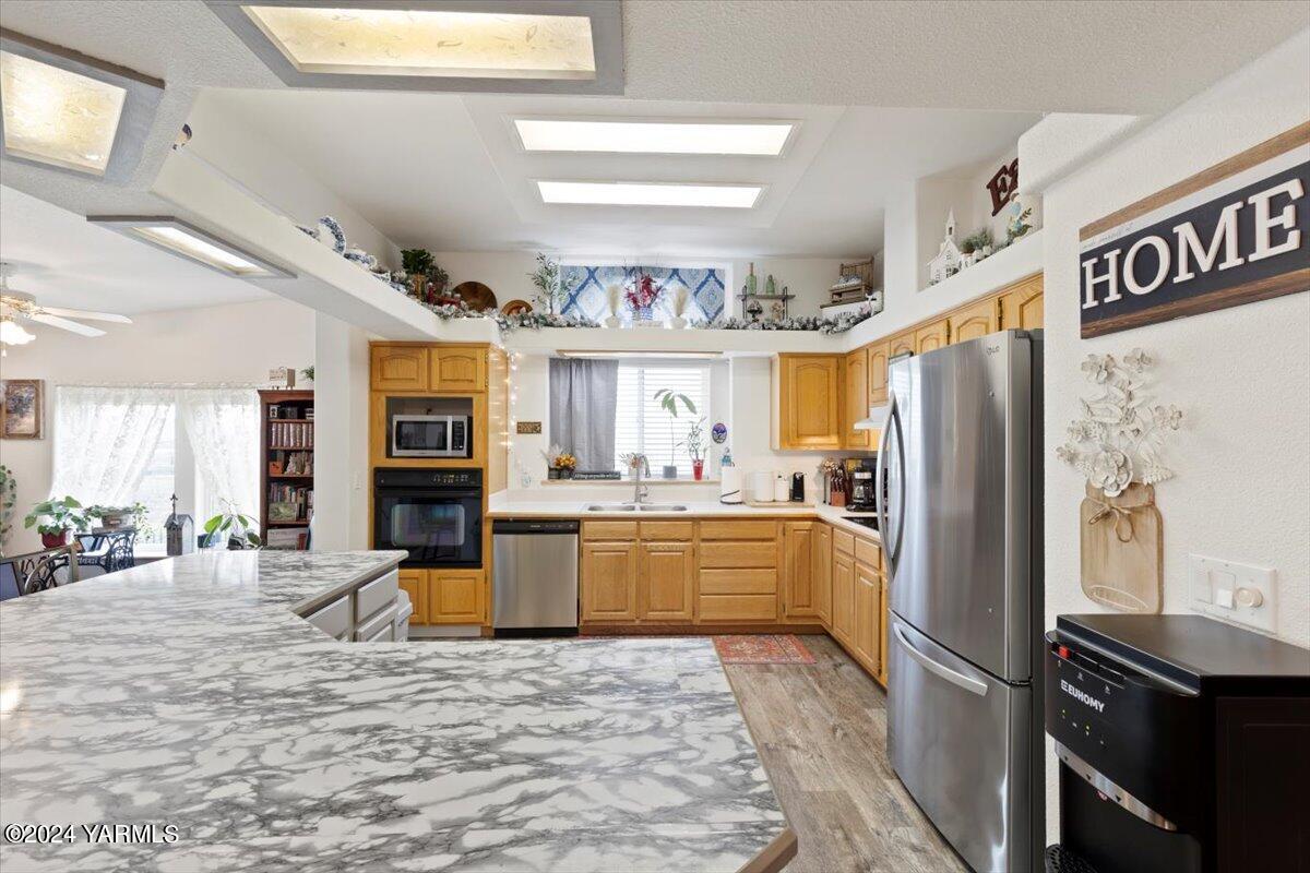 50 Elenbaas Road Granger, WA 98932 - Photo 9 of 35 a kitchen with refrigerator and cabinets