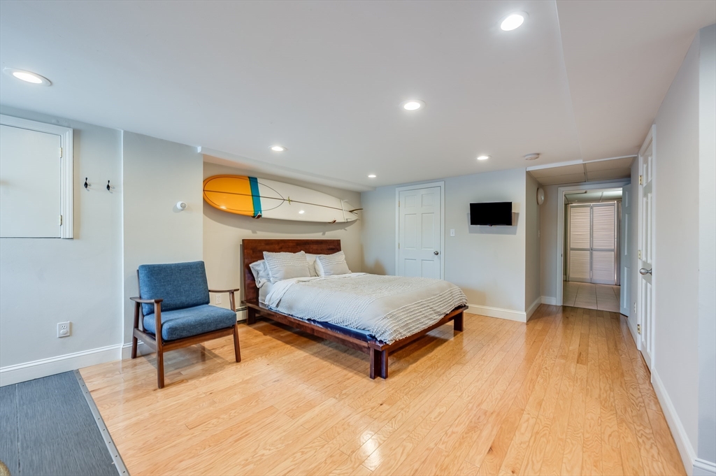 39 Emerson Street Boston, MA 02127 - Photo 17 of 20 a bedroom with a bed and a table