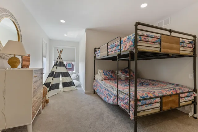 a bedroom with a bed and a cabinets