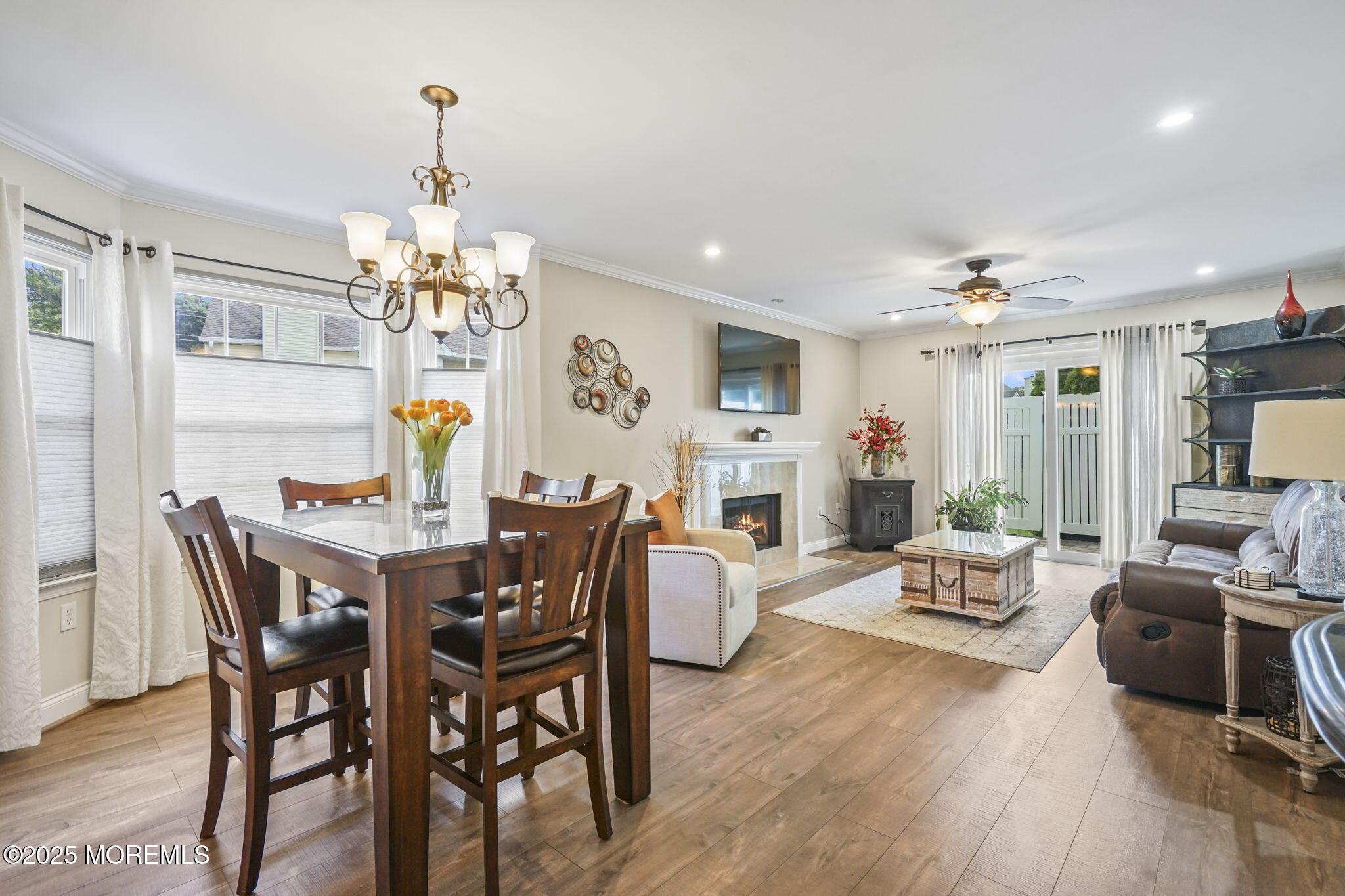 126 Wyckoff Mills Road, Unit 84 Hightstown, NJ 08520 - Photo 15 of 16 a view of a dining room with furniture wooden floor and chandelier