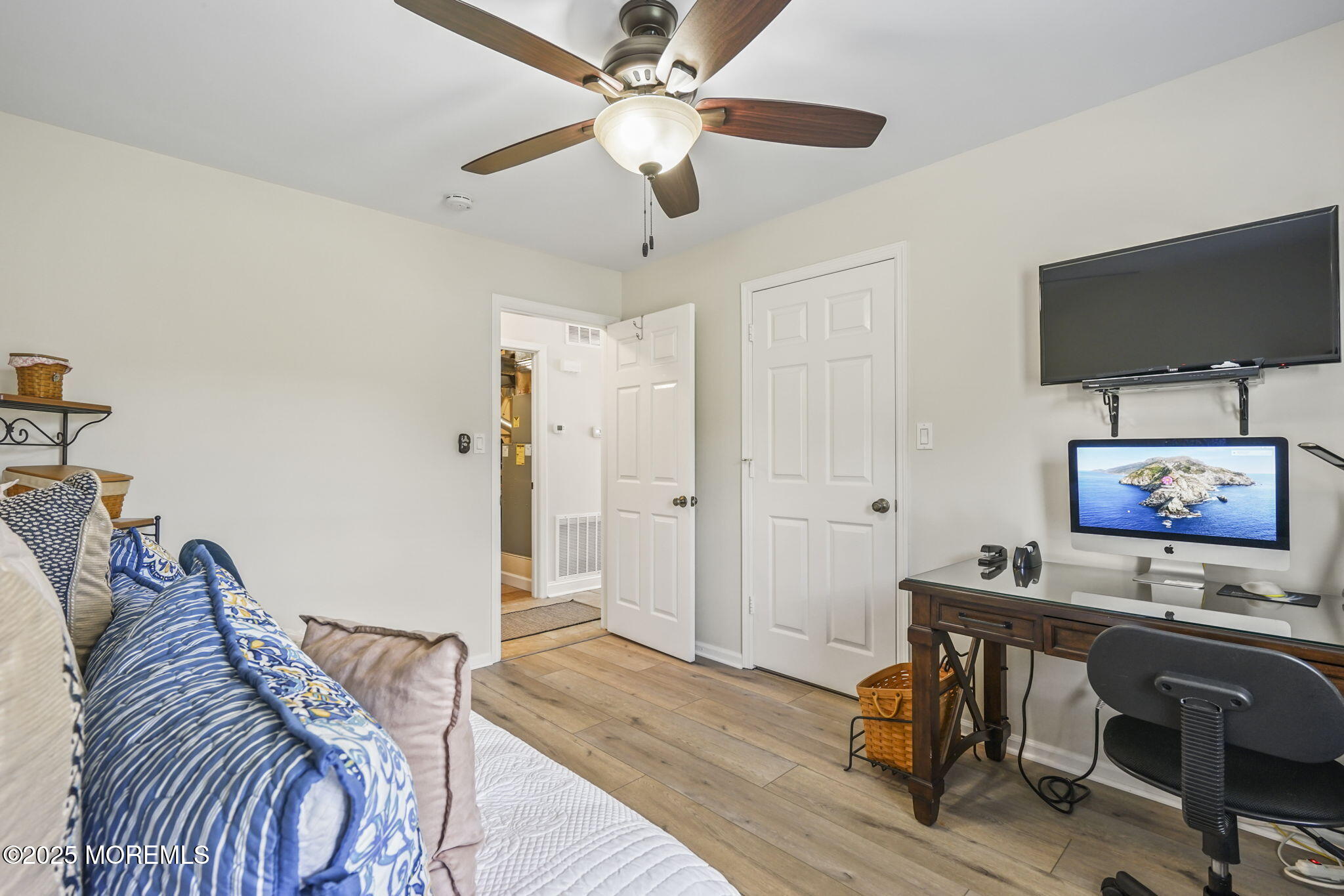 126 Wyckoff Mills Road, Unit 84 Hightstown, NJ 08520 - Photo 7 of 16 a view of a livingroom with furniture and a flat screen tv