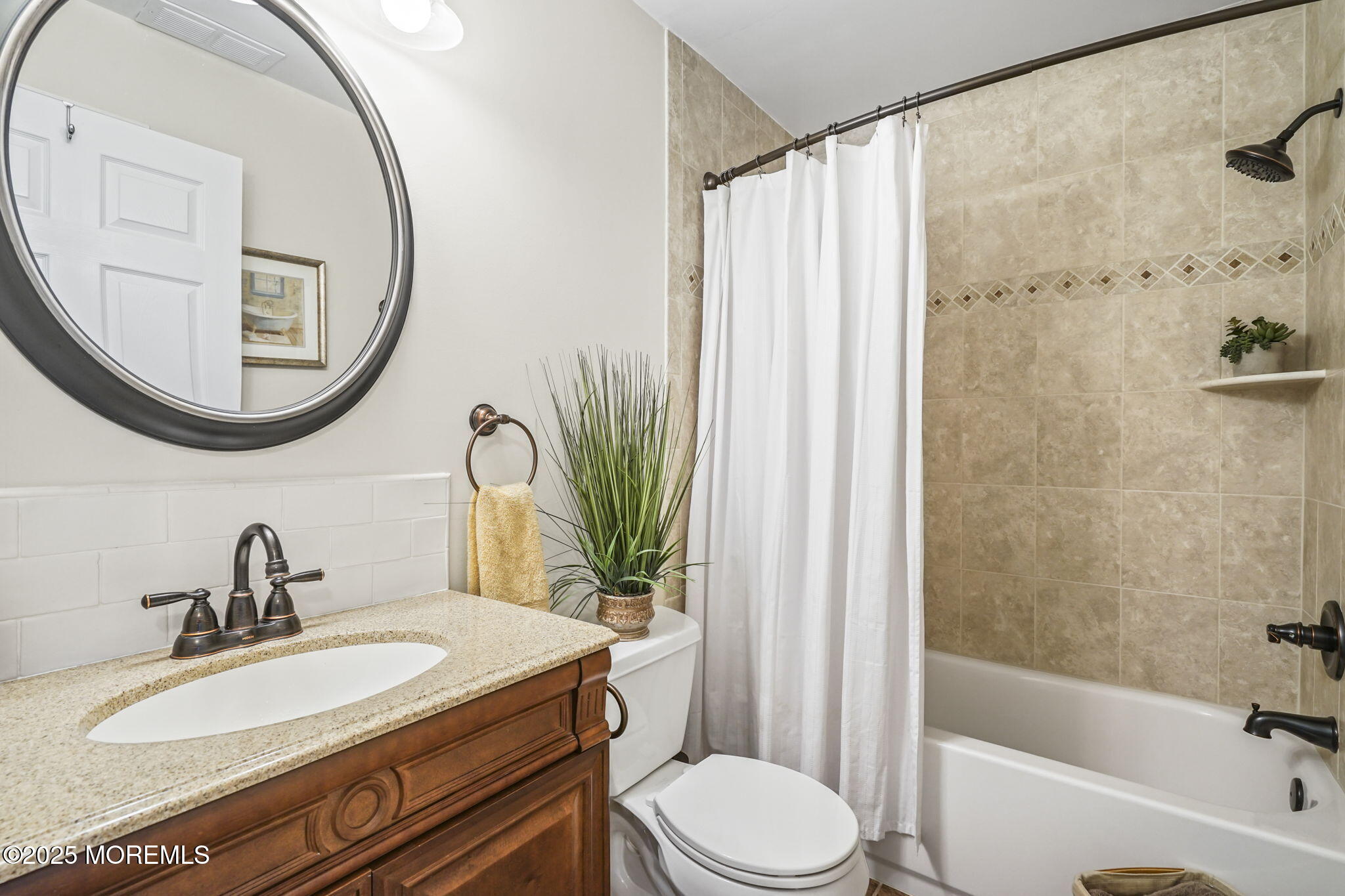 126 Wyckoff Mills Road, Unit 84 Hightstown, NJ 08520 - Photo 8 of 16 a bathroom with a sink a toilet and a mirror
