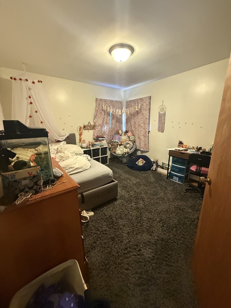 2233 Des Plaines Avenue North Riverside, IL 60546 - Photo 14 of 28 a living room with furniture and a flat screen tv