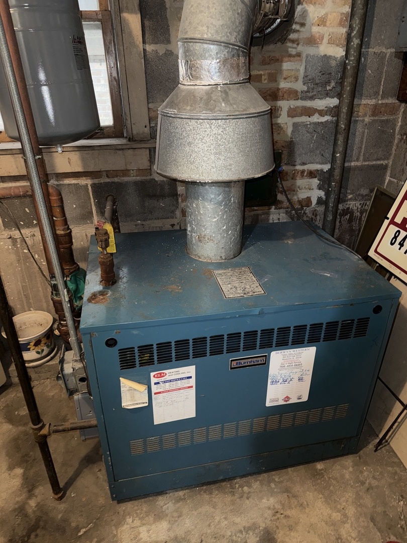 2233 Des Plaines Avenue North Riverside, IL 60546 - Photo 23 of 28 a living room with stainless steel appliances kitchen island granite countertop a stove and a sink