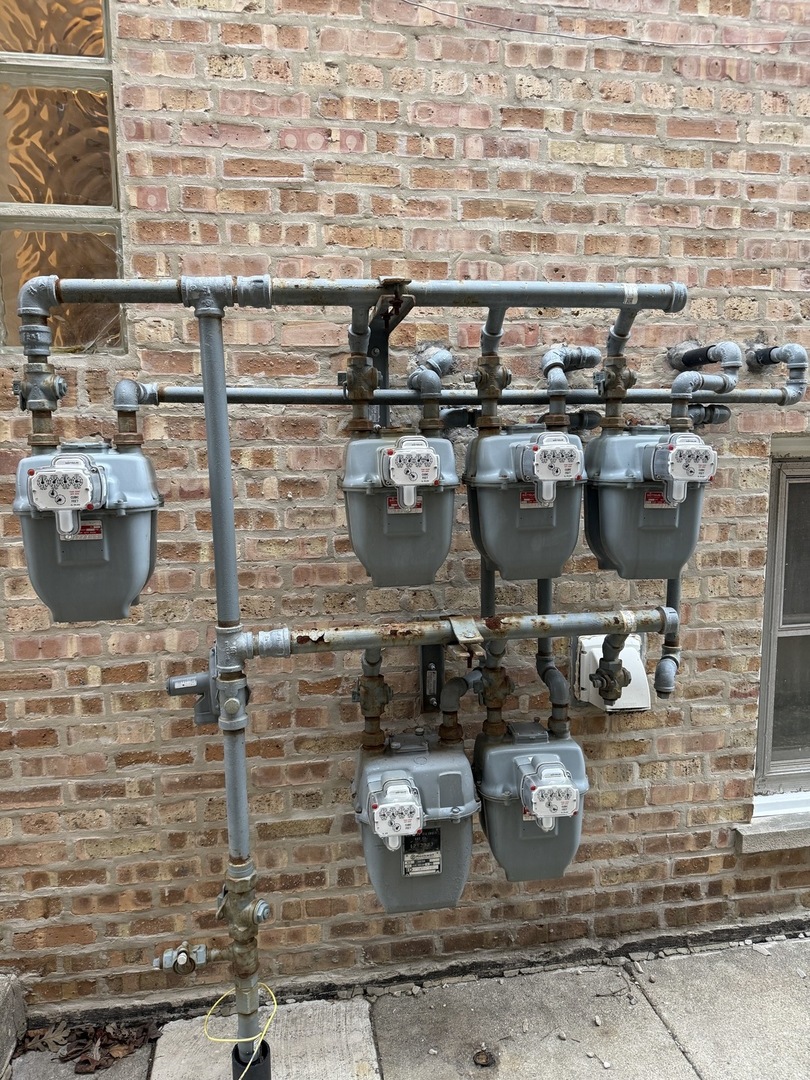 2233 Des Plaines Avenue North Riverside, IL 60546 - Photo 27 of 28 a room with water heater and wooden cabinets