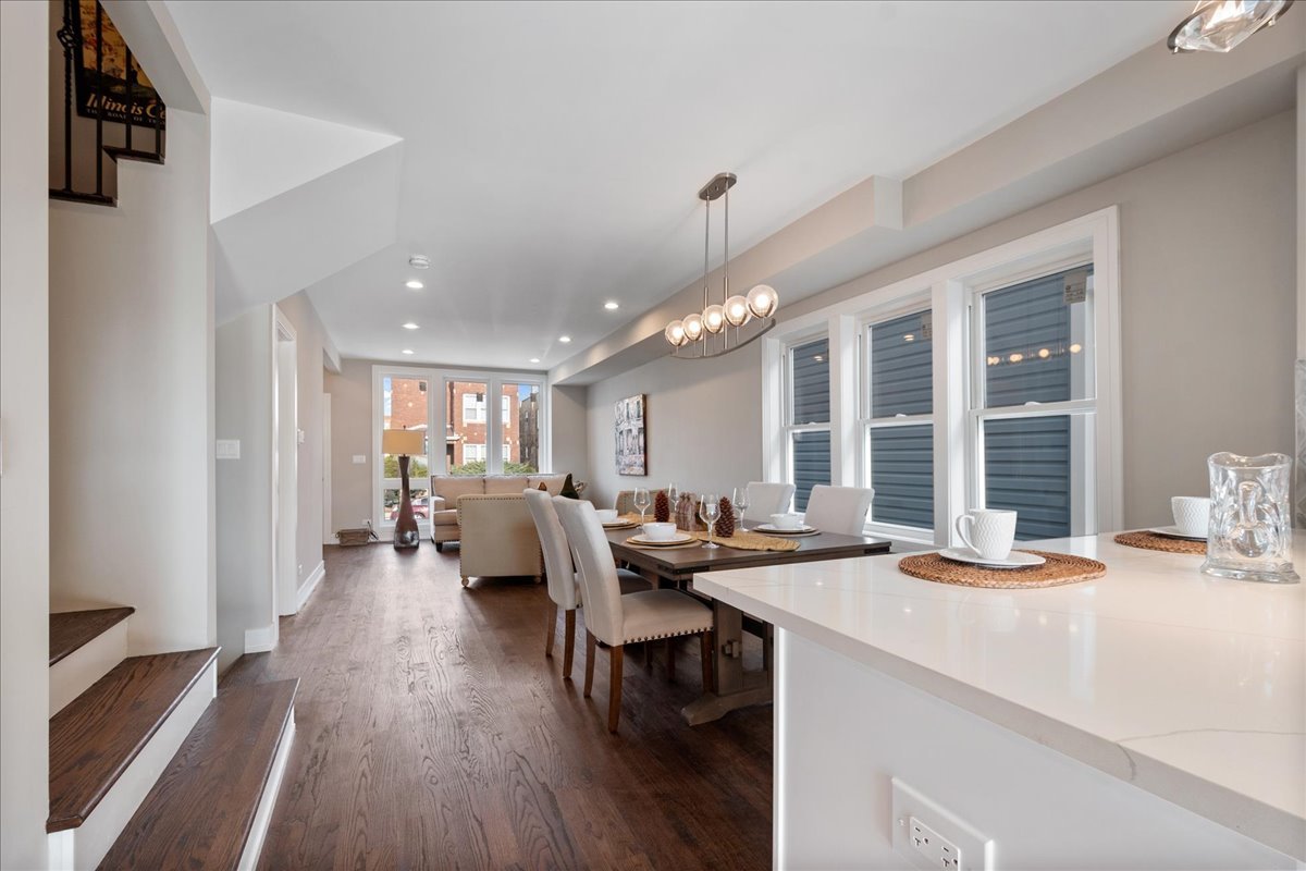 4855 West School Street Chicago, IL 60641 - Photo 13 of 29 a view of a dining room with furniture window and wooden floor