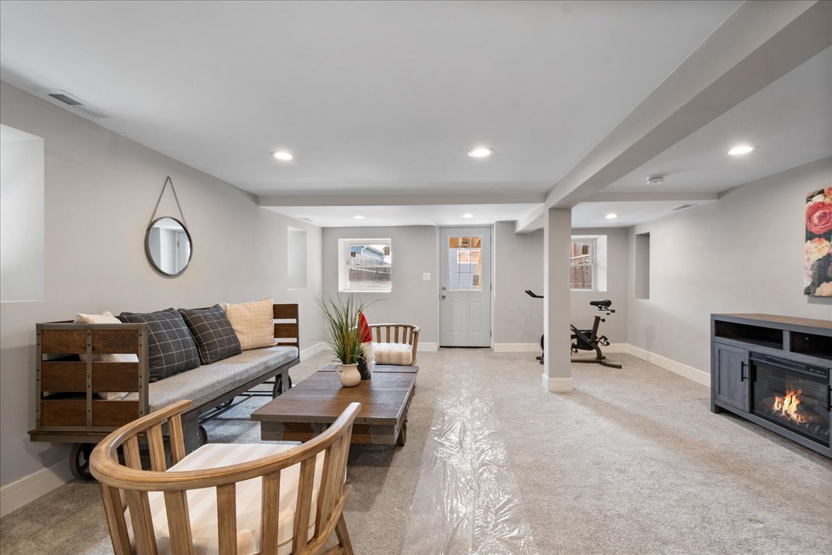4855 West School Street Chicago, IL 60641 - Photo 21 of 29 a living room with furniture and a wooden floor