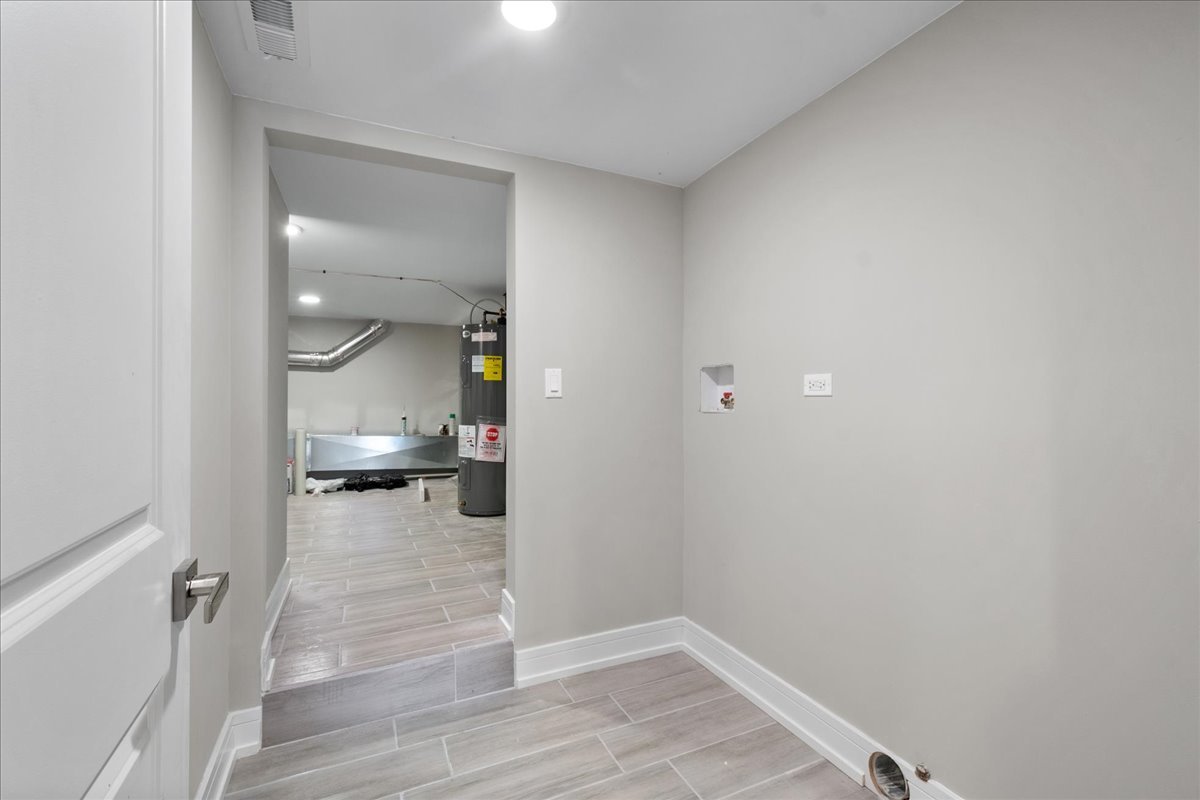 4855 West School Street Chicago, IL 60641 - Photo 26 of 29 a view of a hallway and wooden floor