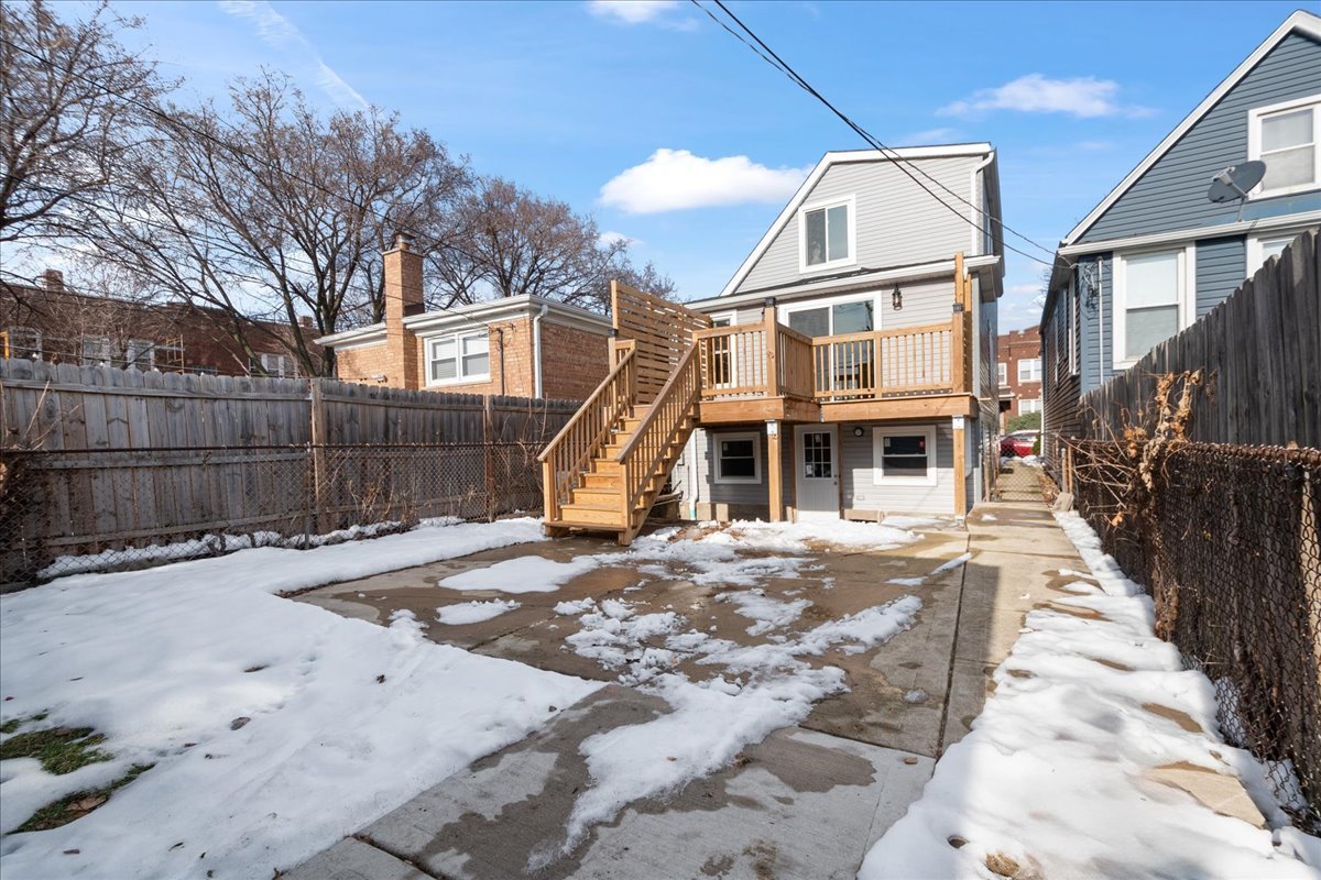 4855 West School Street Chicago, IL 60641 - Photo 27 of 29 a view of a white house with a yard