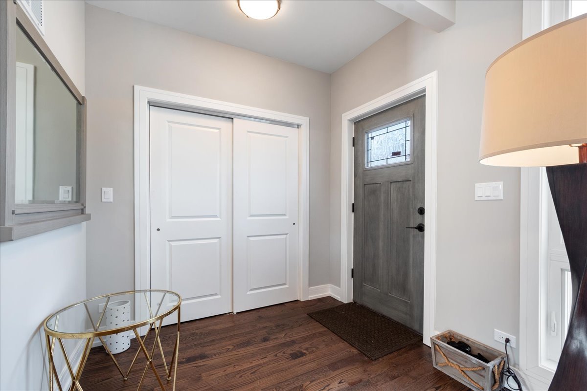 4855 West School Street Chicago, IL 60641 - Photo 3 of 29 an empty room with wooden floor and windows