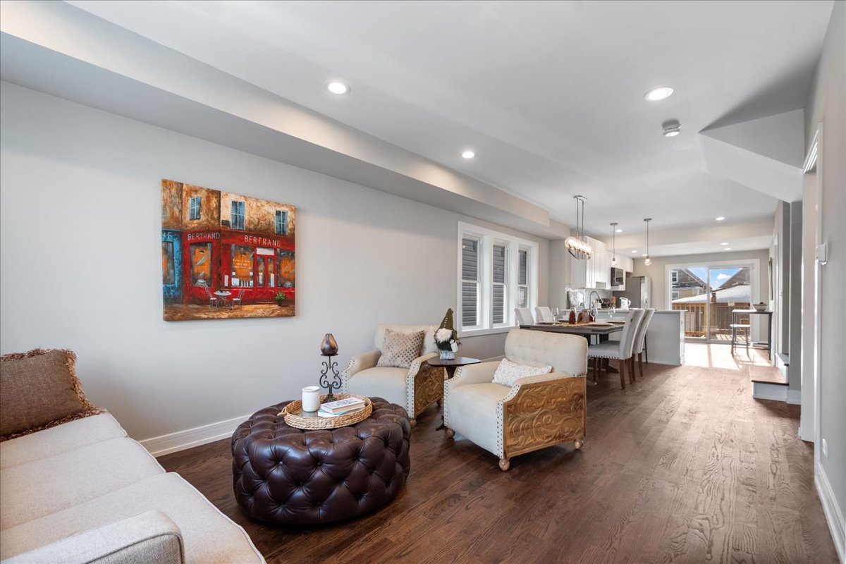 4855 West School Street Chicago, IL 60641 - Photo 4 of 29 a living room with furniture and wooden floor