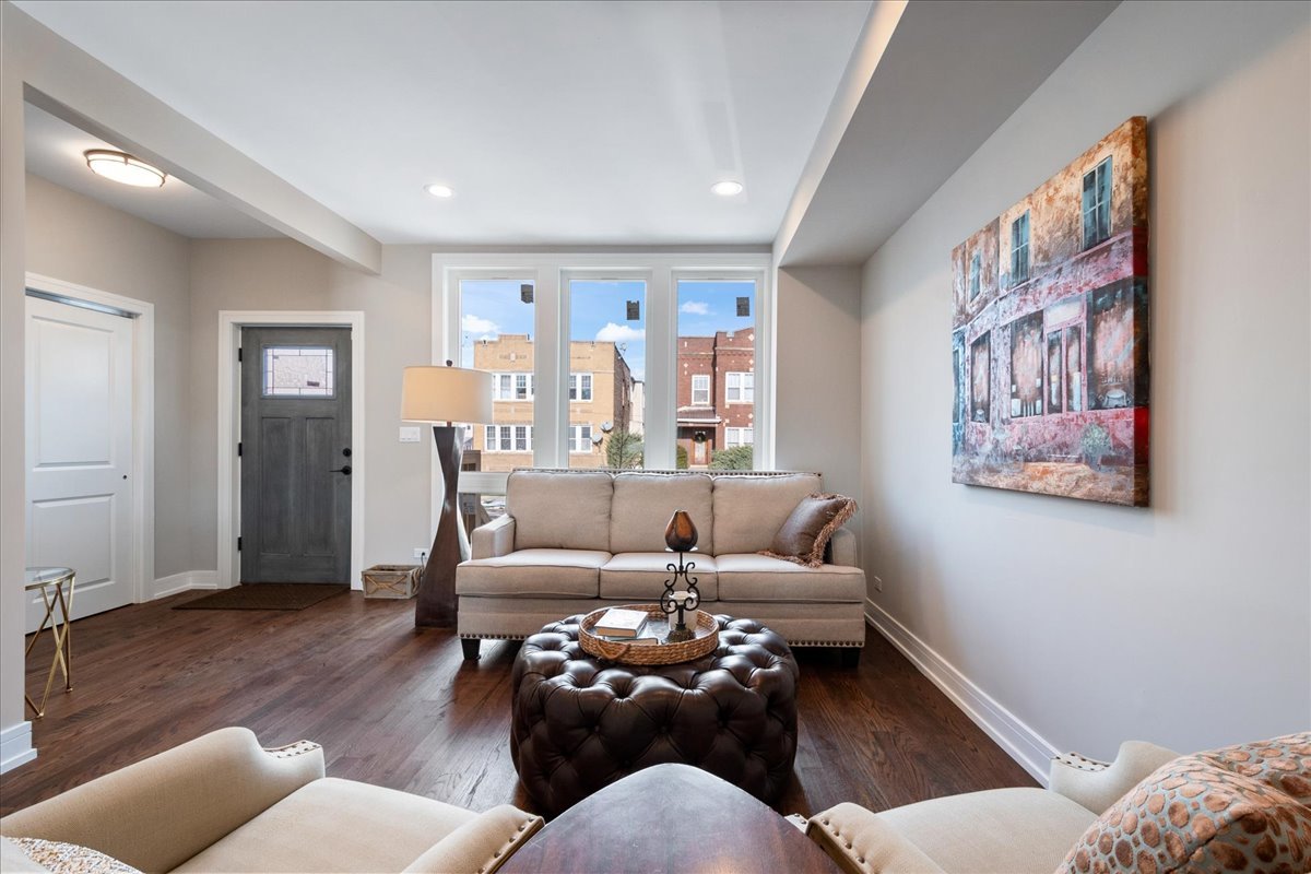 4855 West School Street Chicago, IL 60641 - Photo 5 of 29 a living room with furniture and a wooden floor
