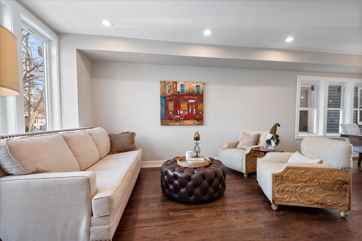 4855 West School Street Chicago, IL 60641 - Photo 6 of 29 a living room with furniture and a large window