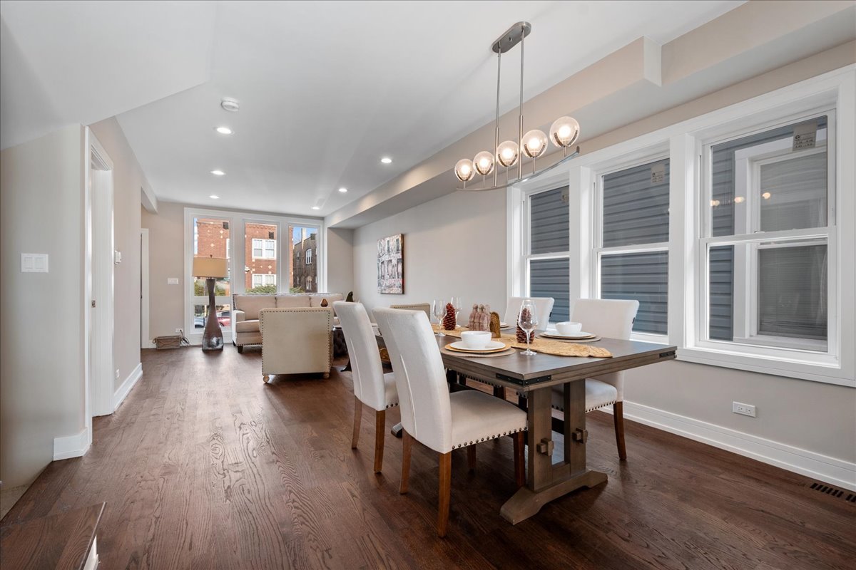 4855 West School Street Chicago, IL 60641 - Photo 8 of 29 a view of a dining room with furniture window and wooden floor