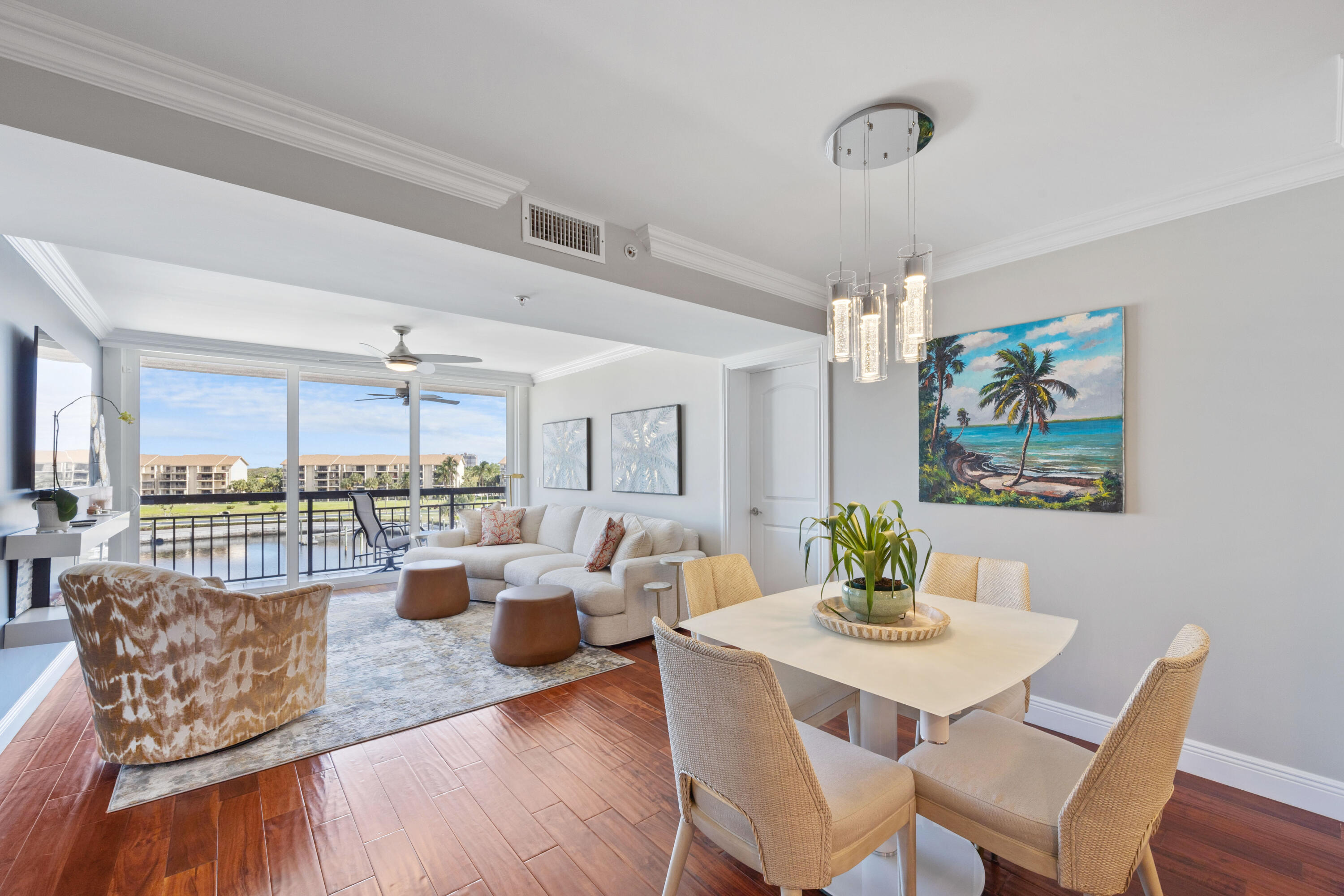 2401 Marina Isle Way, Unit 503 Jupiter, FL 33477 - Photo 10 of 30 a view of a dining room with furniture window and wooden floor