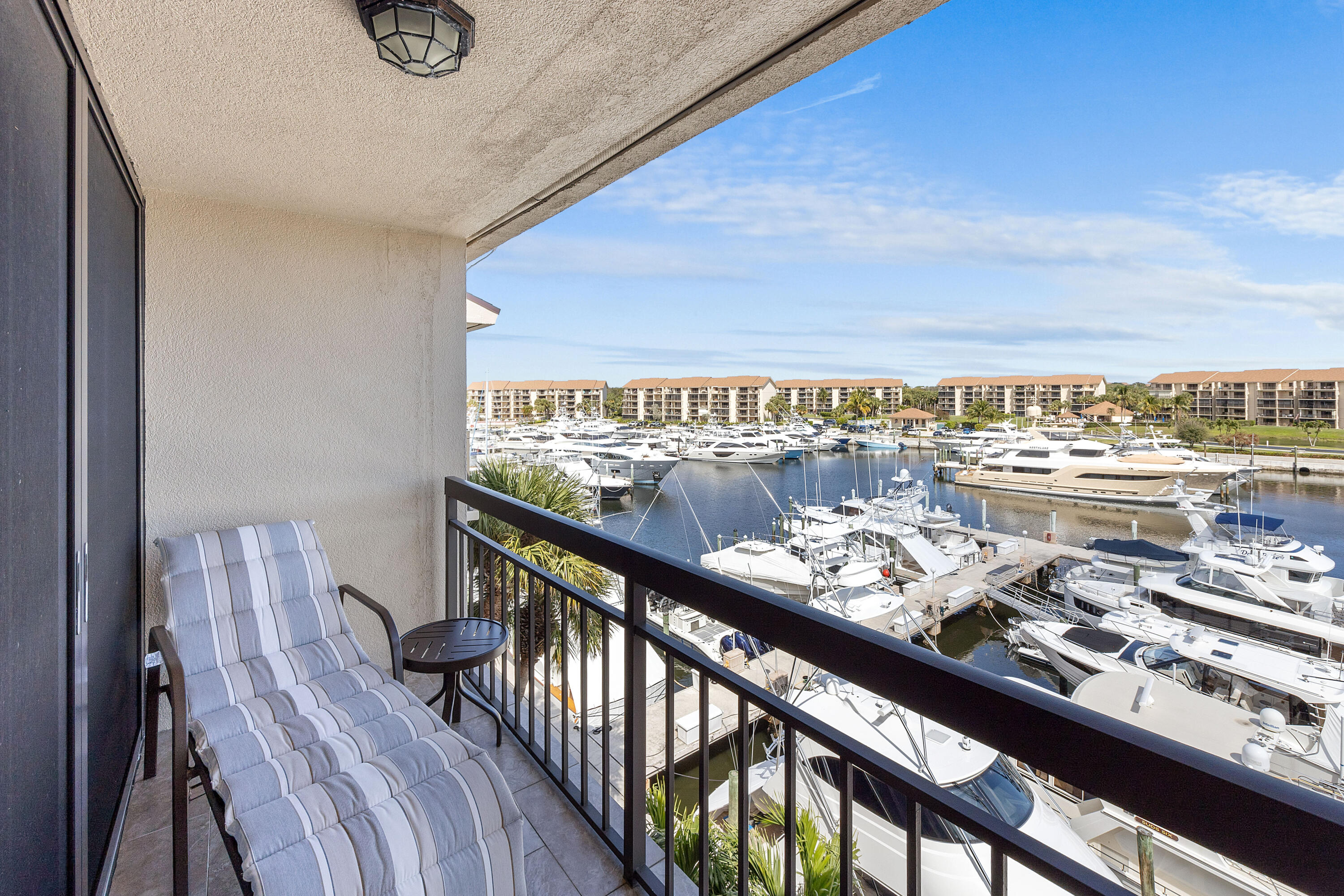 2401 Marina Isle Way, Unit 503 Jupiter, FL 33477 - Photo 17 of 30 a city view from a balcony with furniture