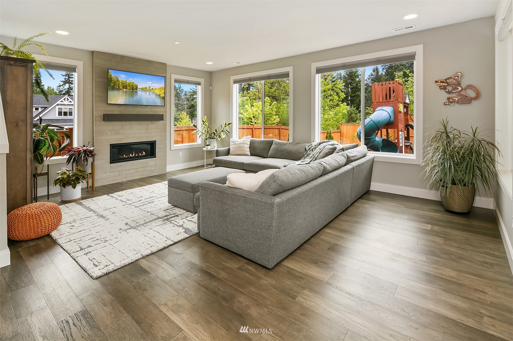236 234th Place Southeast Bothell, WA 98021 - Photo 11 of 39 a living room with furniture large window and flat screen tv