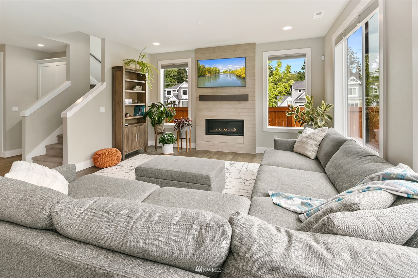236 234th Place Southeast Bothell, WA 98021 - Photo 12 of 39 a living room with furniture and a fireplace