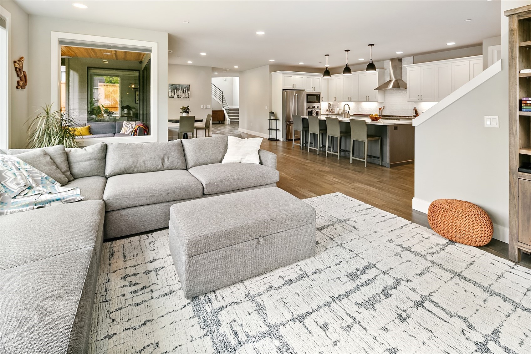 236 234th Place Southeast Bothell, WA 98021 - Photo 13 of 39 a living room with furniture and a dining table with kitchen view