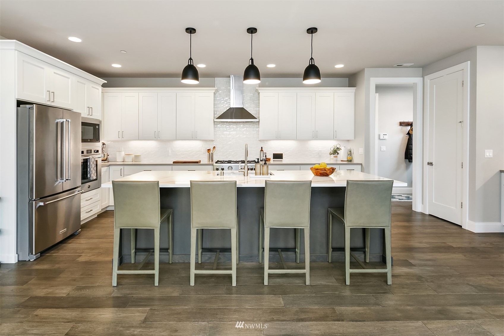 236 234th Place Southeast Bothell, WA 98021 - Photo 14 of 39 a kitchen with stainless steel appliances kitchen island granite countertop a table chairs microwave and sink