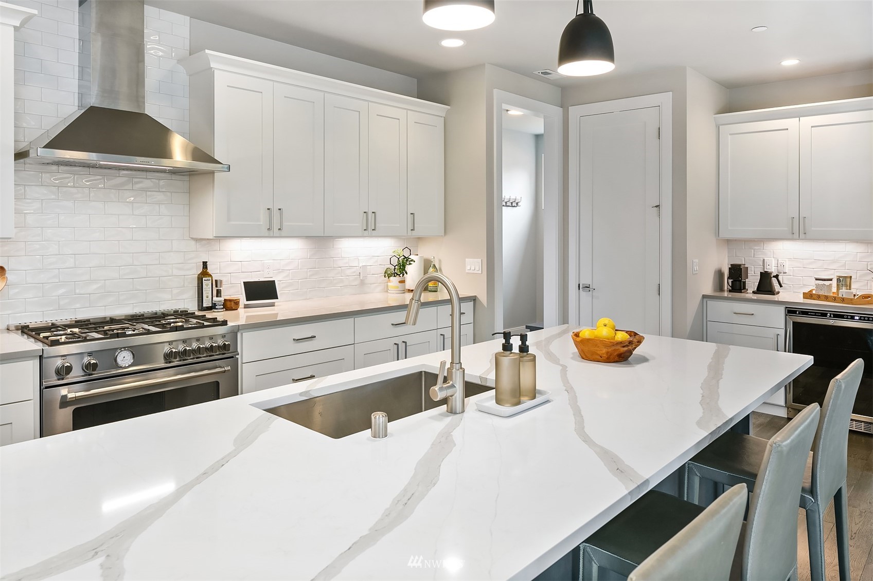 236 234th Place Southeast Bothell, WA 98021 - Photo 17 of 39 a kitchen with a stove a sink and a refrigerator