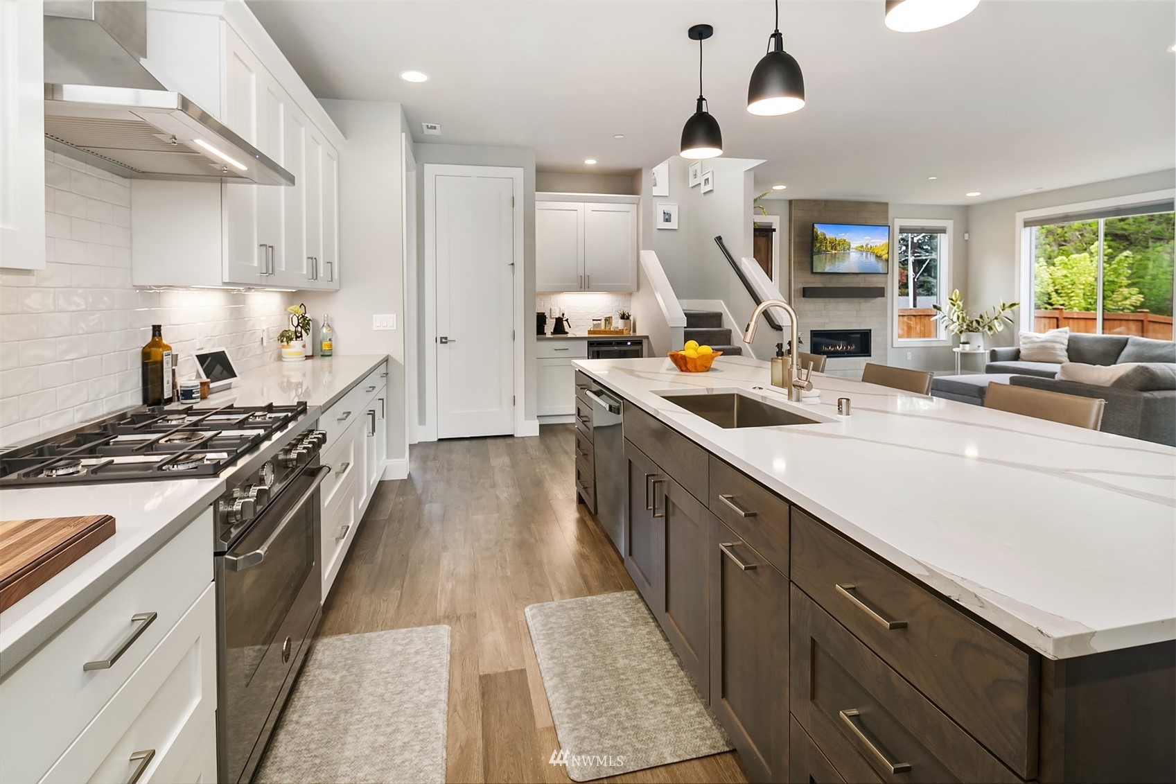 236 234th Place Southeast Bothell, WA 98021 - Photo 19 of 39 a kitchen with stainless steel appliances a sink stove and wooden cabinets