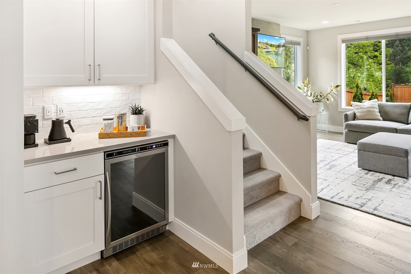 236 234th Place Southeast Bothell, WA 98021 - Photo 20 of 39 a kitchen with stainless steel appliances granite countertop a sink and dishwasher with wooden floor