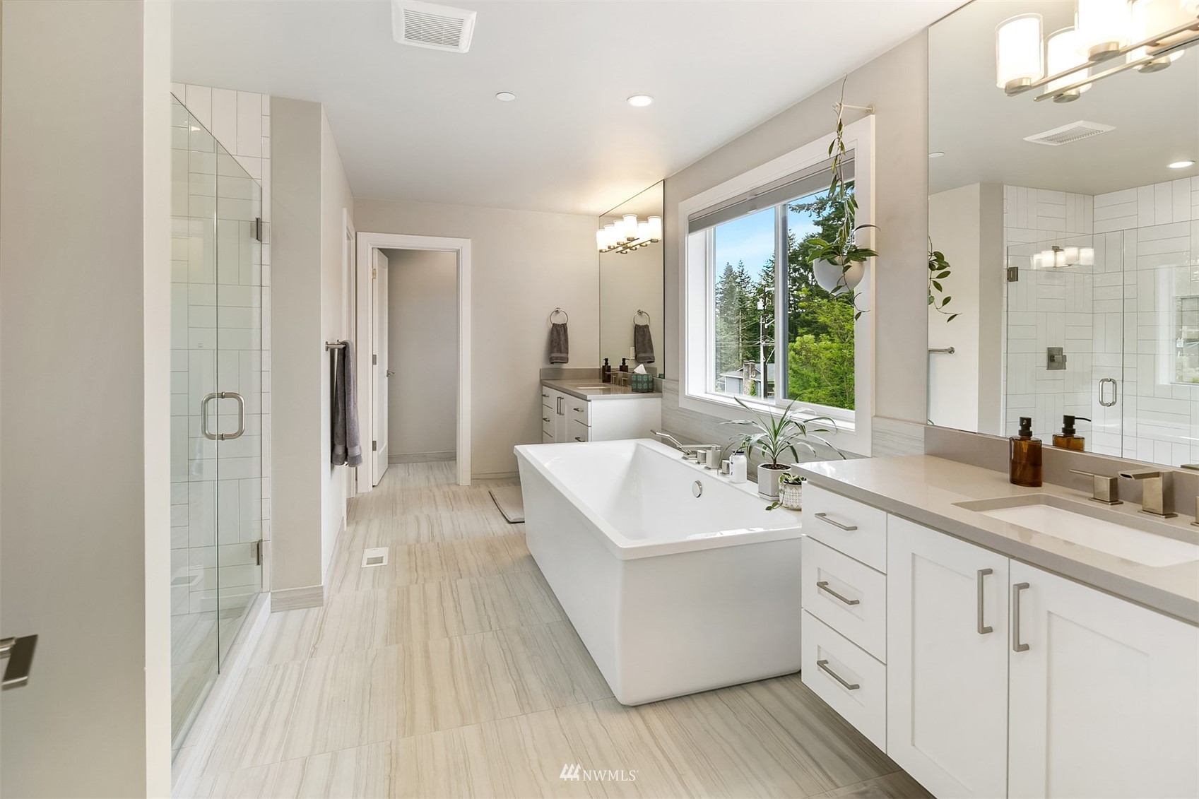 236 234th Place Southeast Bothell, WA 98021 - Photo 26 of 39 a view of a bathroom with a sink mirror and a bathtub