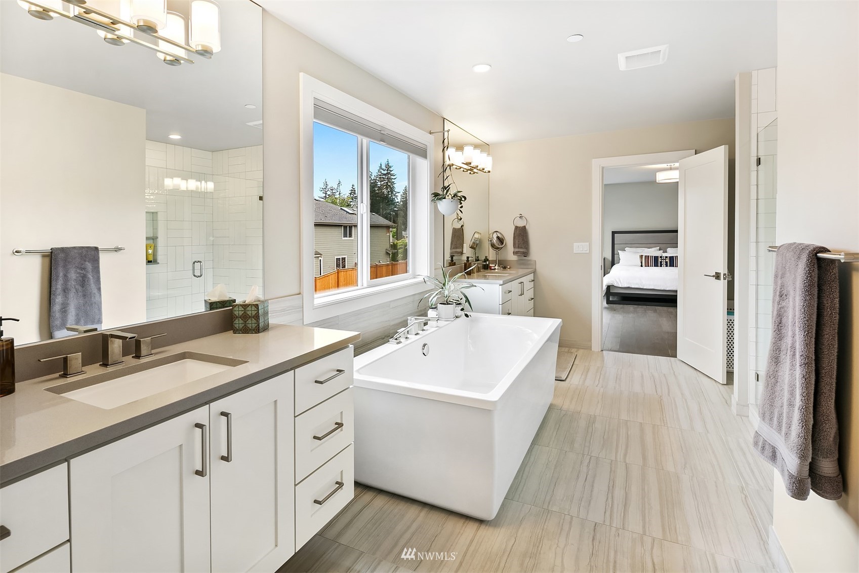 236 234th Place Southeast Bothell, WA 98021 - Photo 27 of 39 a spacious bathroom with a double vanity sink and a mirror