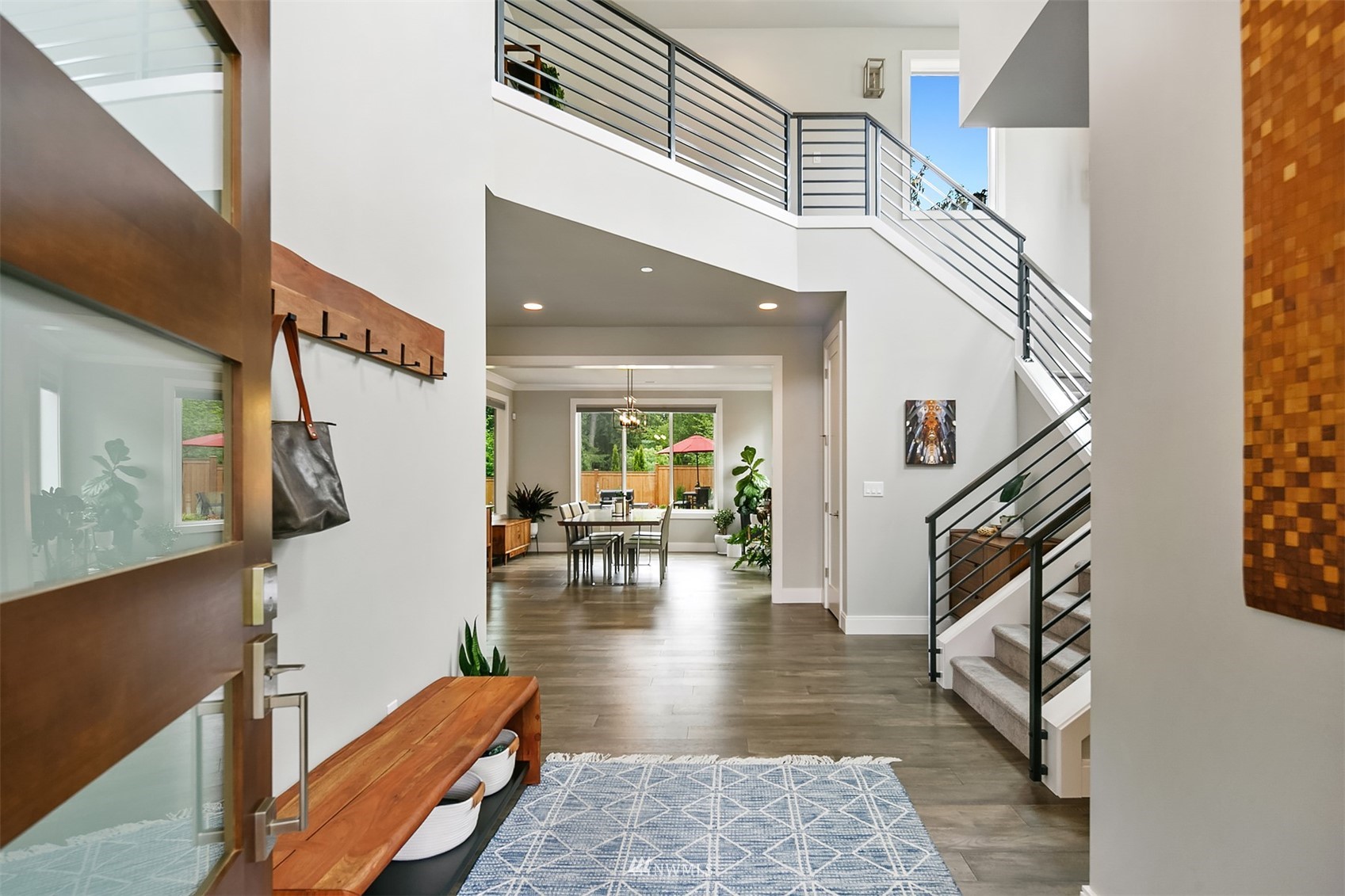 236 234th Place Southeast Bothell, WA 98021 - Photo 3 of 39 a view of entryway and hall with wooden floor