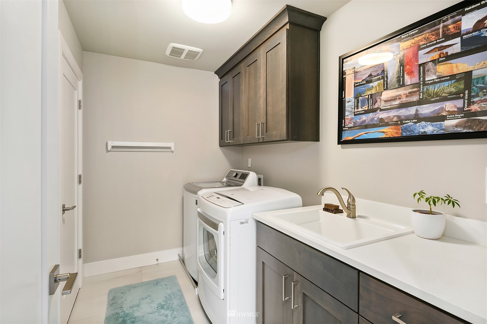 236 234th Place Southeast Bothell, WA 98021 - Photo 31 of 39 a utility room with a sink dryer and washer