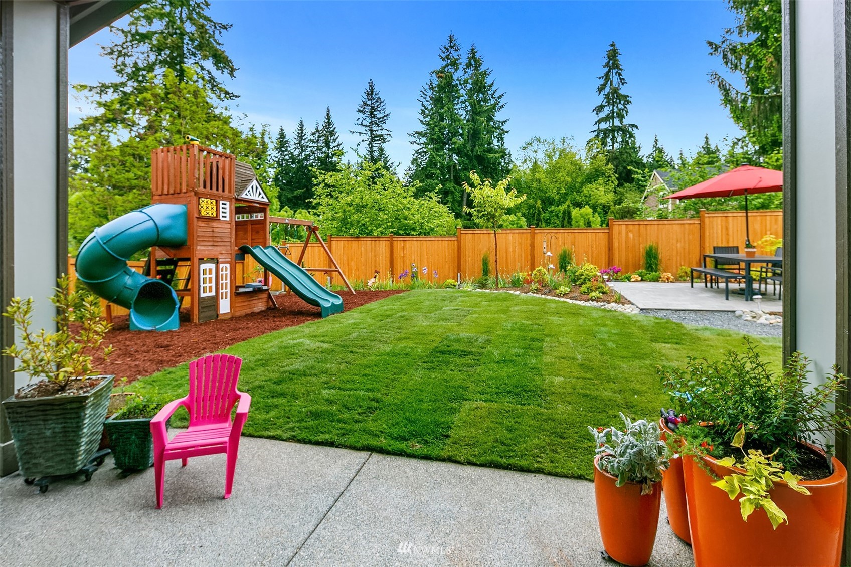 236 234th Place Southeast Bothell, WA 98021 - Photo 36 of 39 a backyard of a house with table and chairs