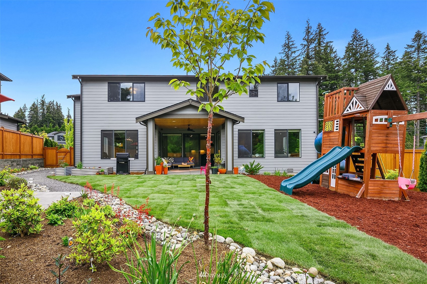 236 234th Place Southeast Bothell, WA 98021 - Photo 39 of 39 a front view of a house with a yard