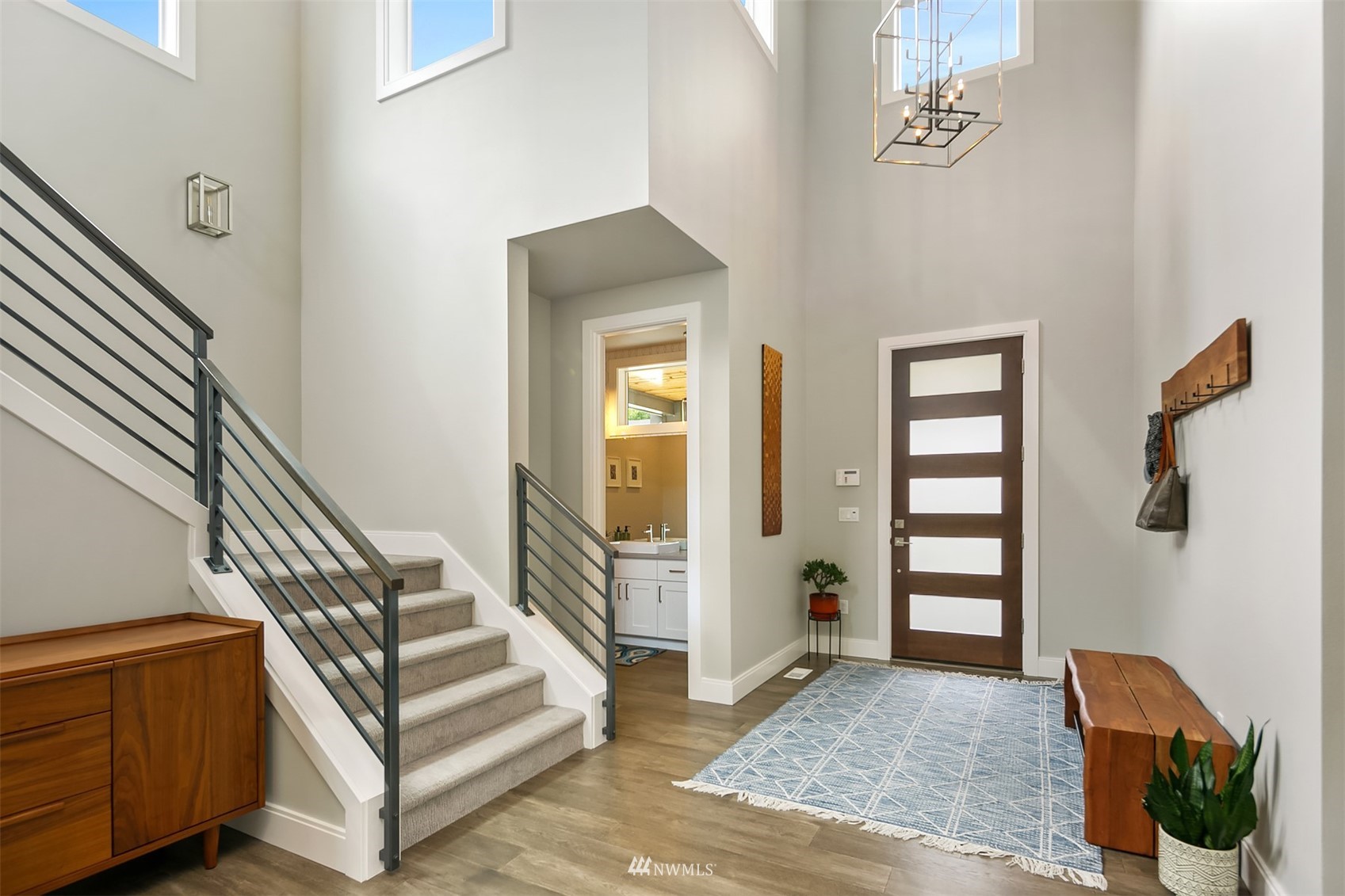 236 234th Place Southeast Bothell, WA 98021 - Photo 4 of 39 a view of entryway with wooden floor and stairs