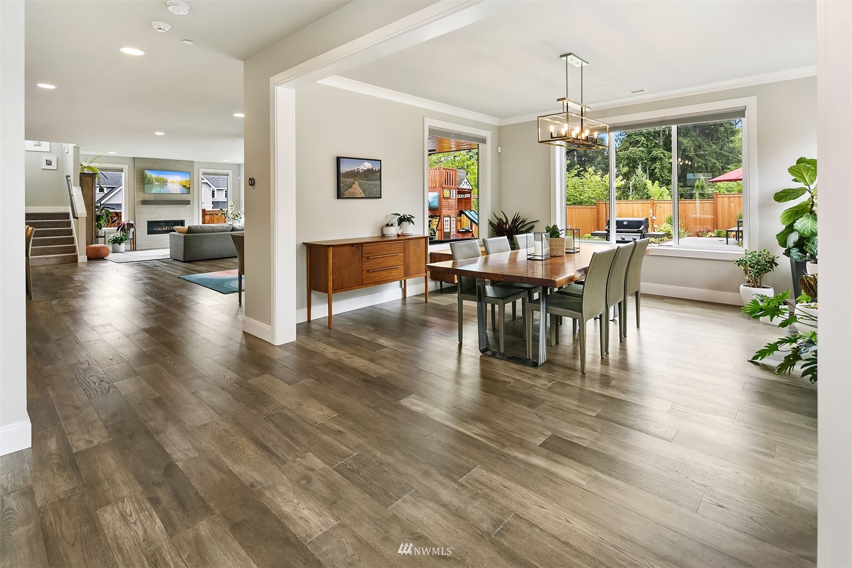 236 234th Place Southeast Bothell, WA 98021 - Photo 7 of 39 a view of a dining room with furniture window and wooden floor