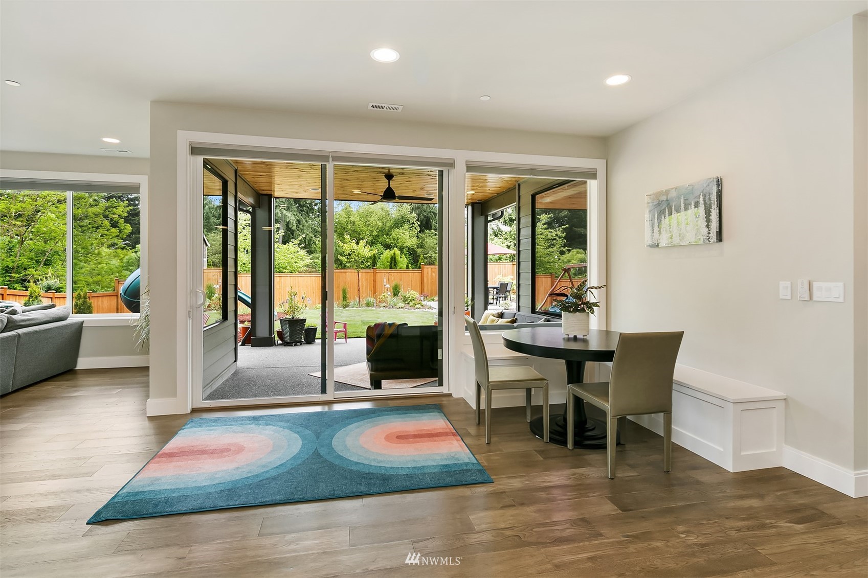 236 234th Place Southeast Bothell, WA 98021 - Photo 10 of 39 a living room with furniture large windows and wooden floor