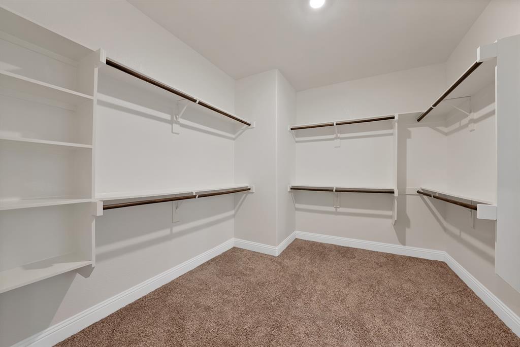 10401 Table Blf Street Aubrey, TX 76227 - Photo 11 of 25 a view of an empty walk in closet