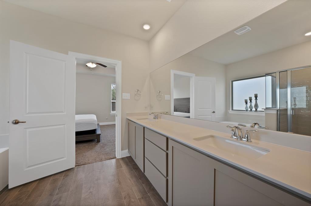 10401 Table Blf Street Aubrey, TX 76227 - Photo 14 of 25 a spacious bathroom with a double vanity sink and mirror