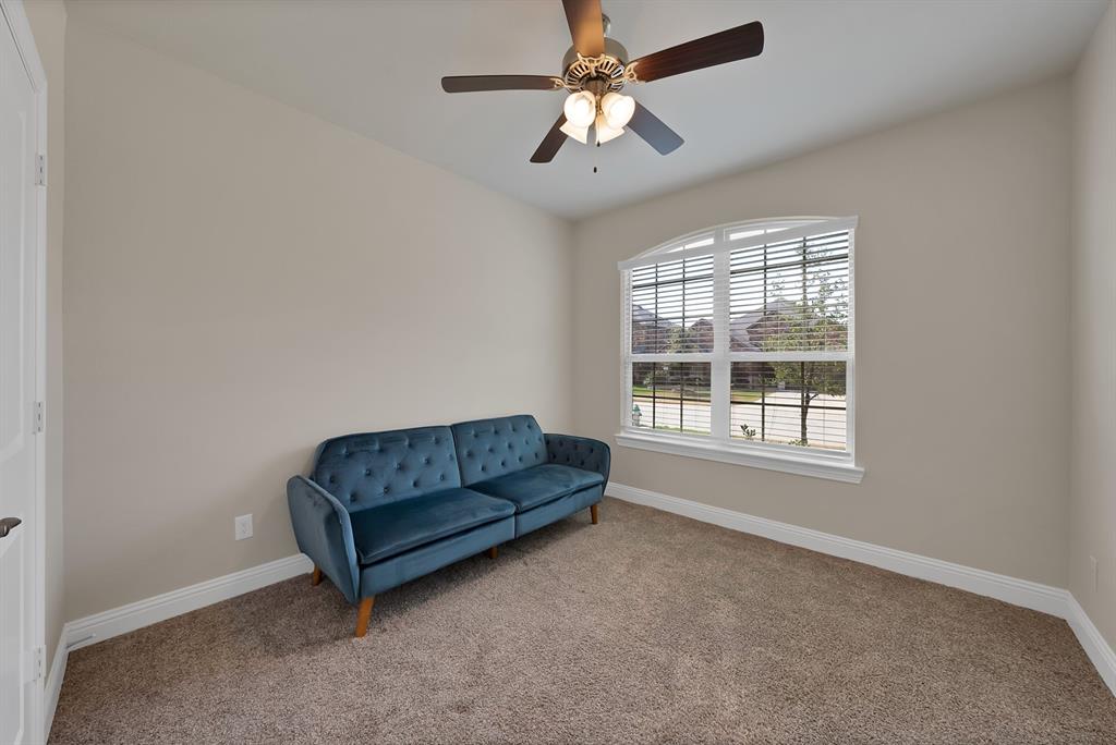 10401 Table Blf Street Aubrey, TX 76227 - Photo 17 of 25 a living room with furniture and a window