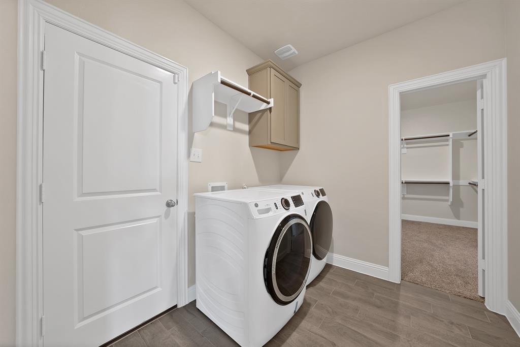 10401 Table Blf Street Aubrey, TX 76227 - Photo 18 of 25 a utility room with dryer and washer
