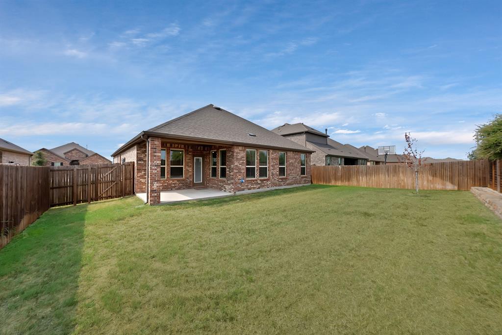 10401 Table Blf Street Aubrey, TX 76227 - Photo 19 of 25 a front view of a house with garden