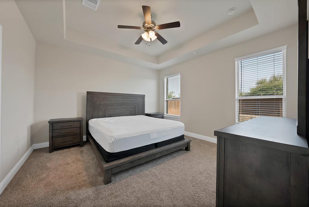10401 Table Blf Street Aubrey, TX 76227 - Photo 9 of 25 a bedroom with a bed and window