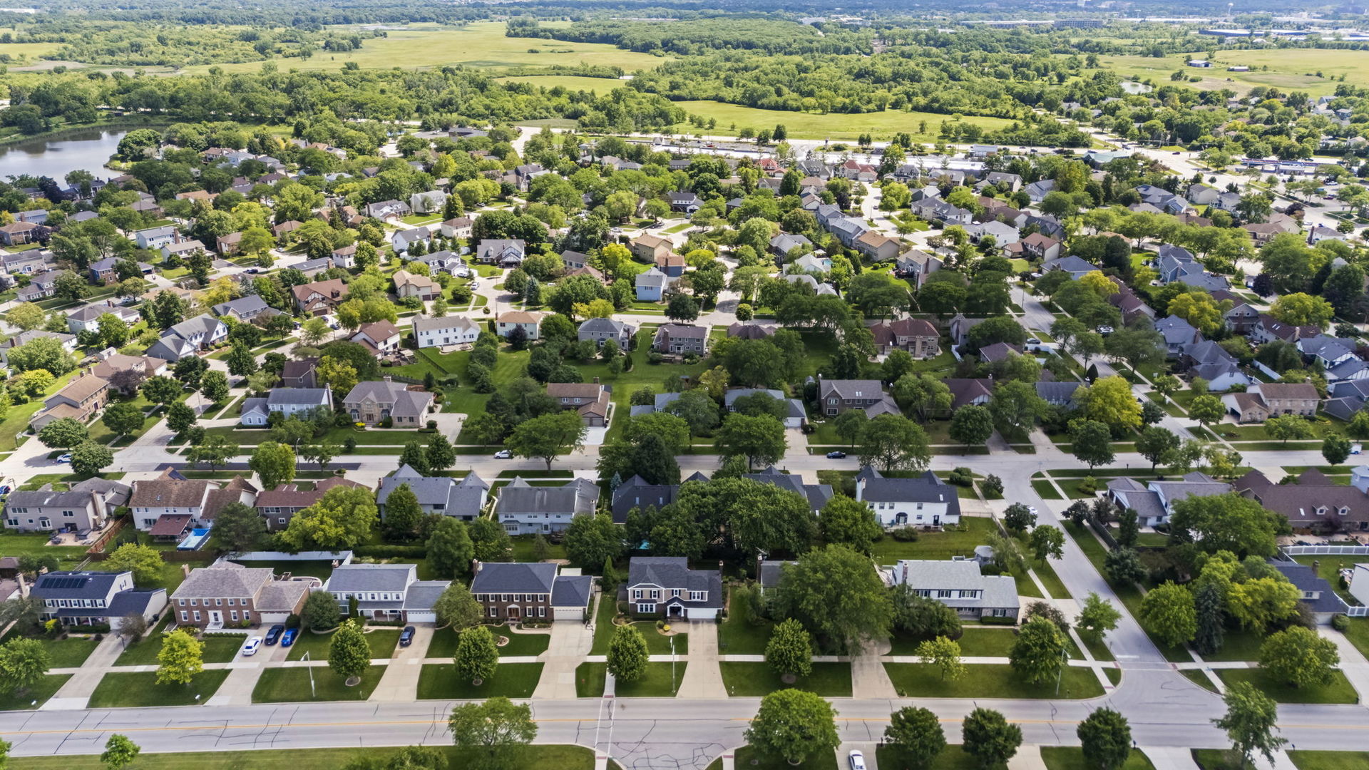 1565 Freeman Road Hoffman Estates, IL 60192 - Photo 42 of 46 an aerial view of residential houses with outdoor space and trees