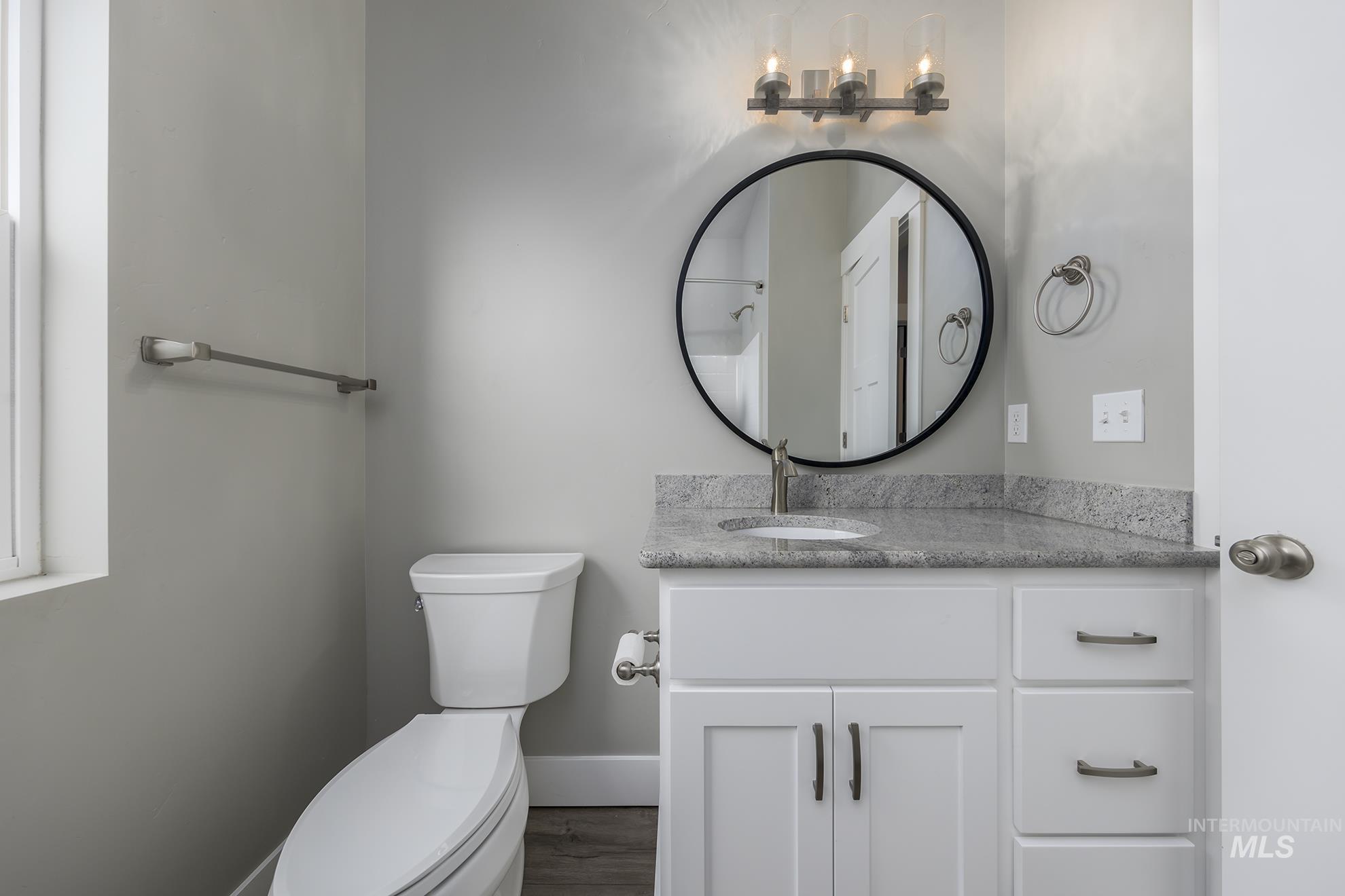 2808 Tamarack Street Fruitland, ID 83619 - Photo 26 of 36 Bathroom with vanity and dark wood finished floors