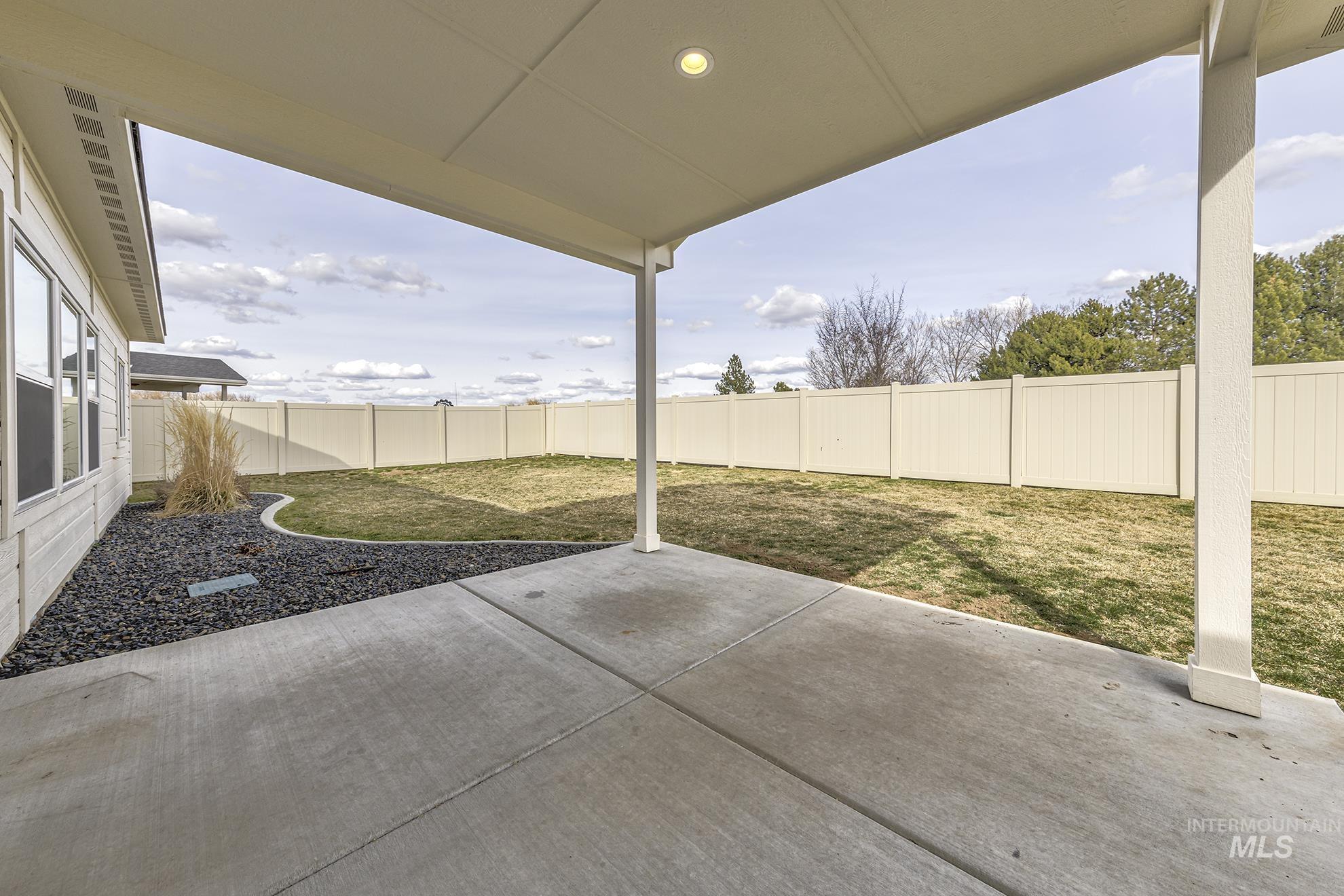 2808 Tamarack Street Fruitland, ID 83619 - Photo 30 of 36 Fenced backyard featuring a patio