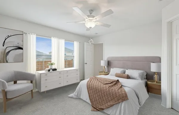 a bedroom with a large bed and a large window